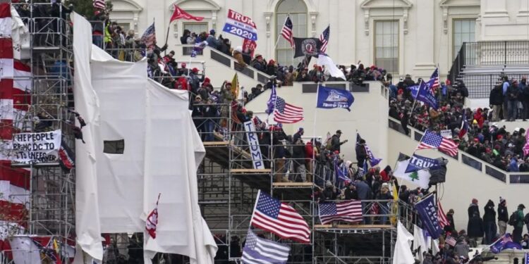Man Who Stormed Capitol With Confederate Flag And Pepper Sprayed Officers Sentenced To Prison